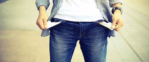 Man in jeans with his pockets turned inside out