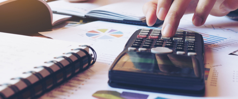 A man working on a calculator